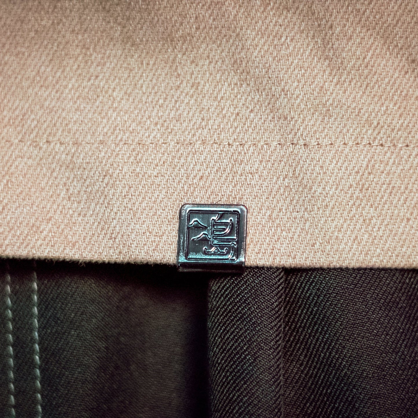 Close-up of a brand logo on a textured surface